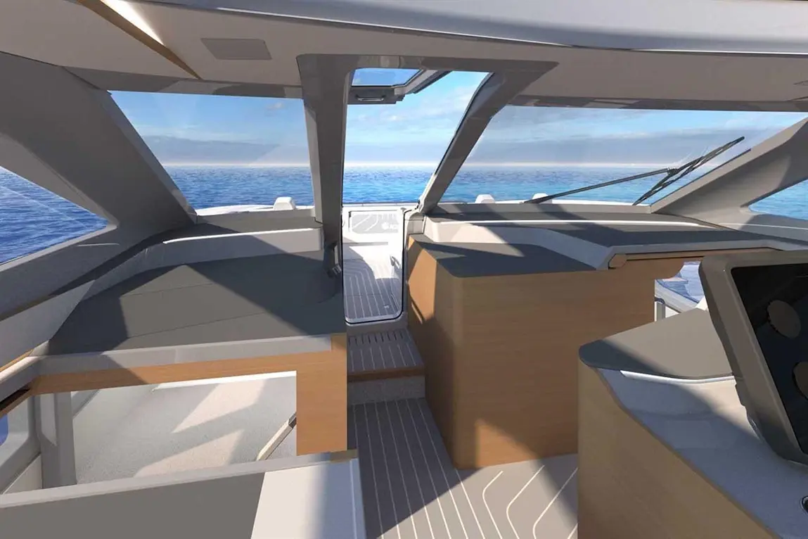 Interior view of a modern yacht, showcasing sleek furniture, a panoramic window, and a scenic ocean backdrop.